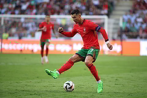 Cristiano Ronaldo controls the ball against Ireland